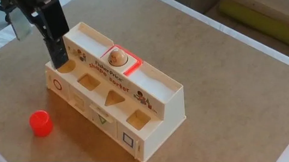 Scene camera: the shape sorter with the red cylinder